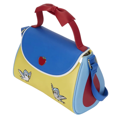 Colorful handbag with red handle, blue top, and yellow base featuring cartoon characters and an apple.
