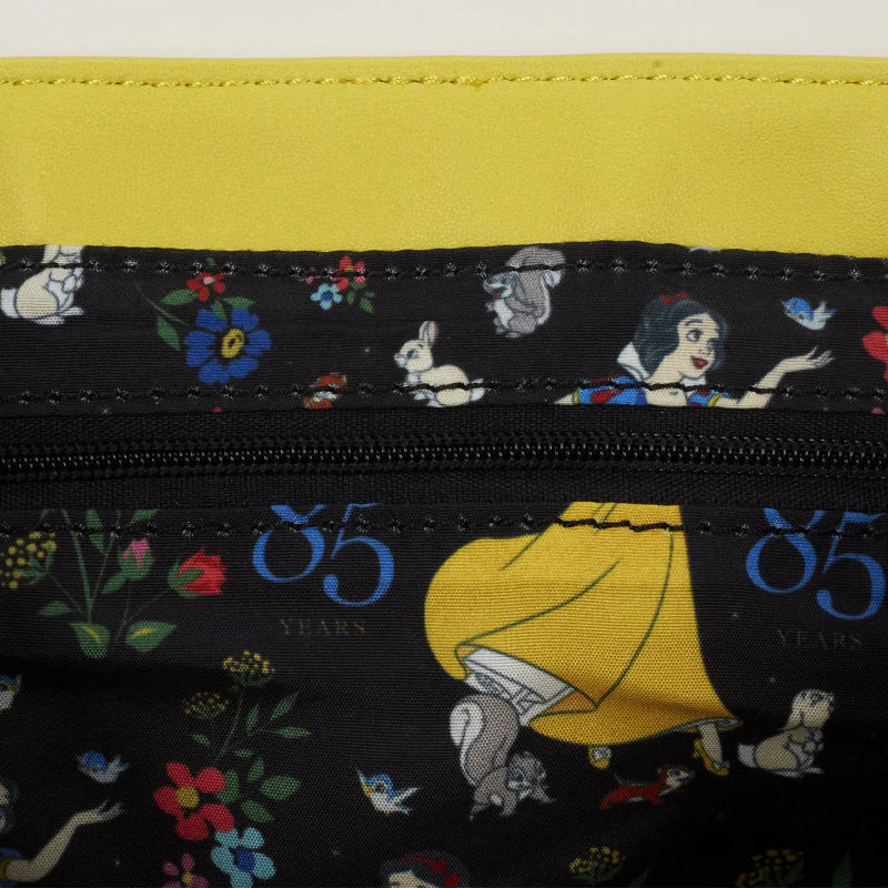 Close-up of a bag with Disney character design and '85 Years' text on a yellow background.