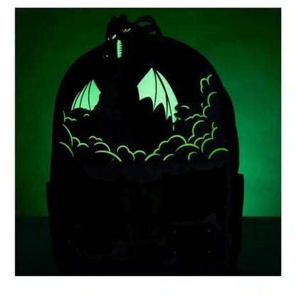 Glowing dragon silhouette in a dark enclosure with a green light on a black background
