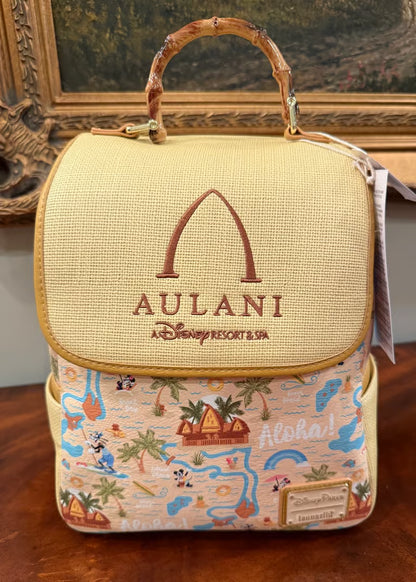 Backpack with Aulani logo and tropical design on a wooden surface