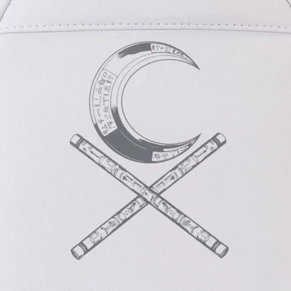 Decorative design of a crescent moon and crossed sticks on a white background