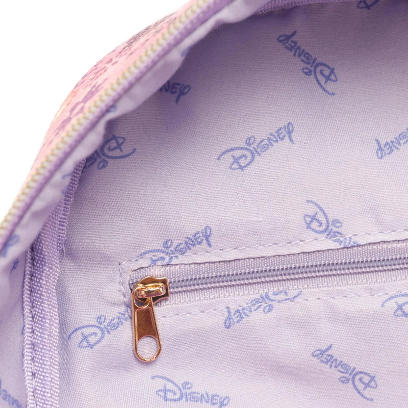 Close-up of a Disney-branded bag interior with a light lavender lining printed with repeating Disney logos, a gold-tone zipper pull, and part of a pink patterned exterior visible at the top edge.