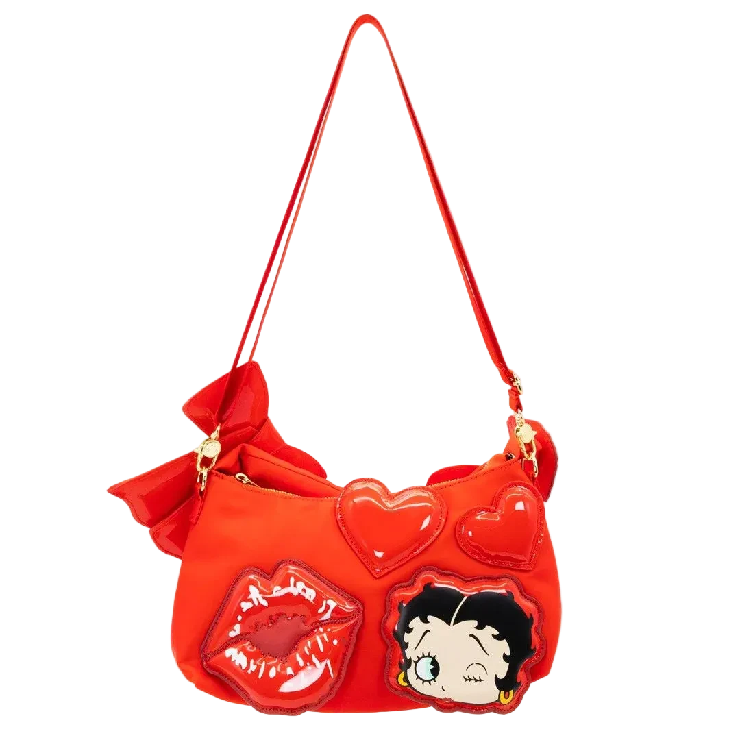 Red handbag with heart shapes, lips, and a character design on a white background