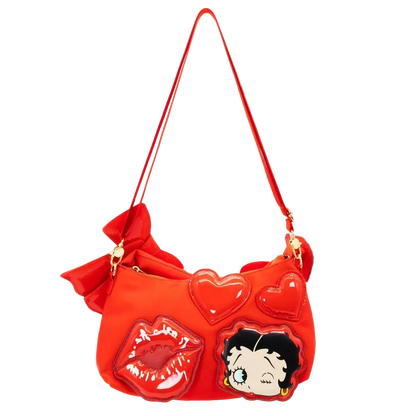 Red handbag with heart shapes, lips, and a character design on a white background