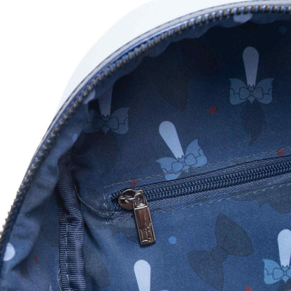 Close-up of a blue pouch with bow pattern and zipper