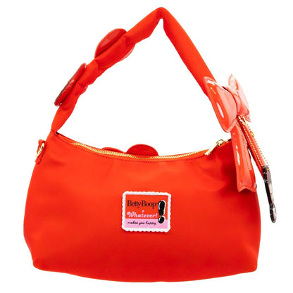 Red handbag with a bow and Betty Boop label on a white background