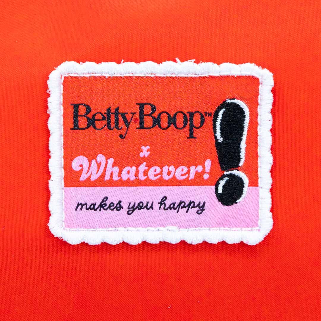 Patch with 'Betty Boop Whatever! makes you happy' text on a red background