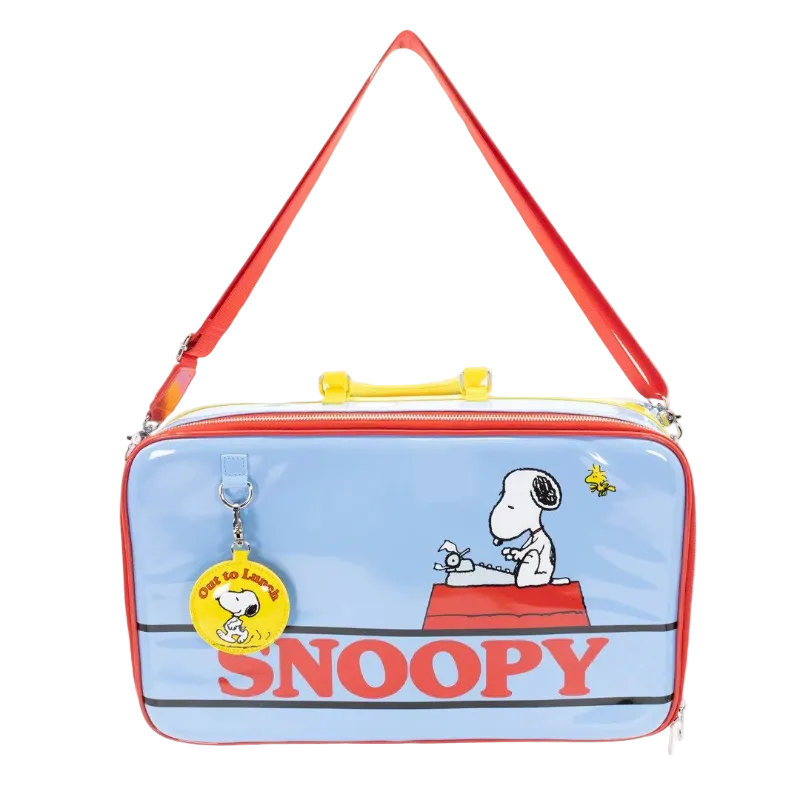 Snoopy-themed bag with a red strap and blue body featuring cartoon characters.