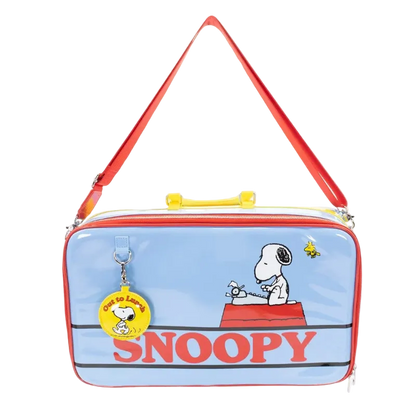Snoopy-themed bag with a red strap and blue body featuring cartoon characters.
