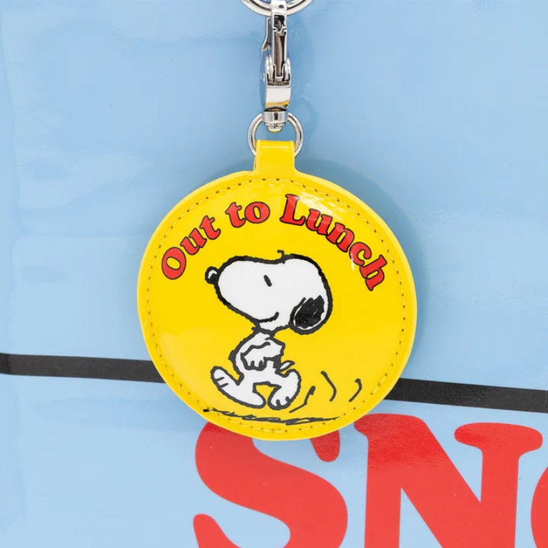 Yellow keychain with Snoopy and 'Out to Lunch' text on a blue background