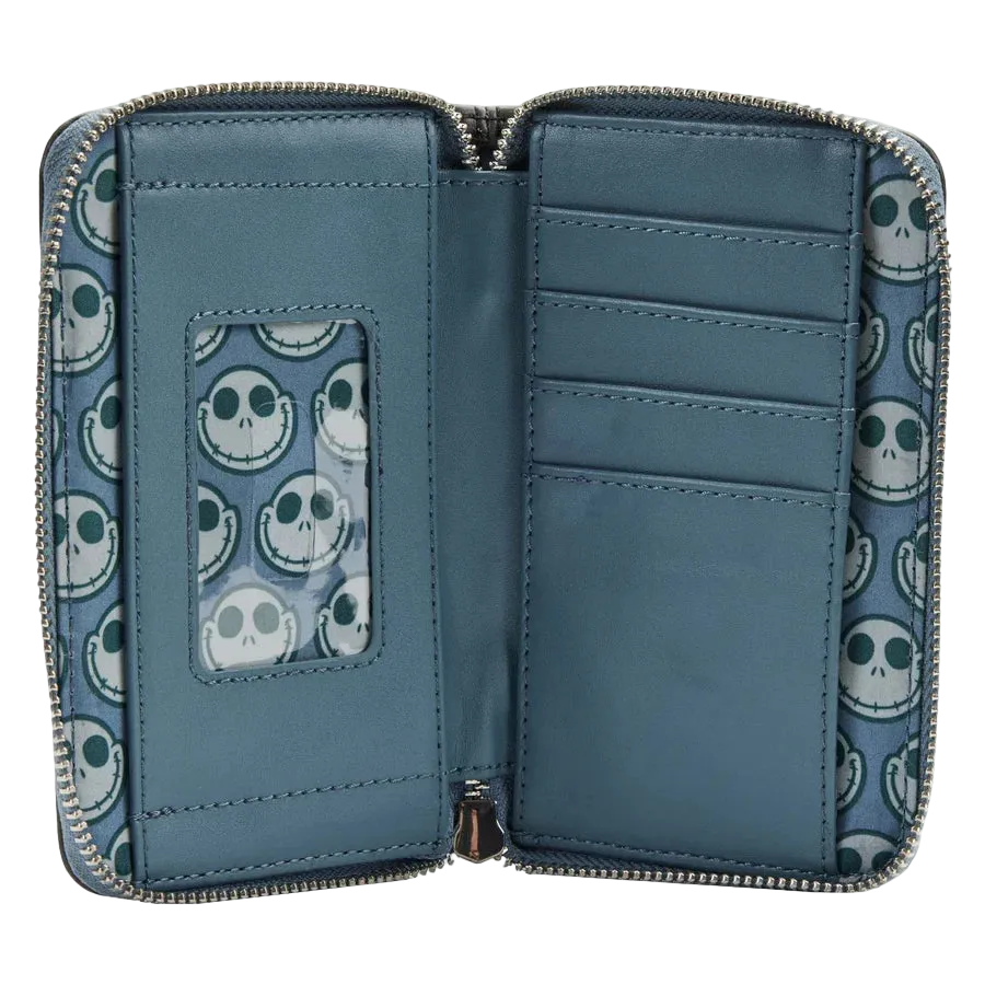 An open zip-around wallet with a blue interior and a repeating skull pattern on the exterior and inner card slots. The wallet features multiple card compartments, a vertical ID window, and a zipper closure.