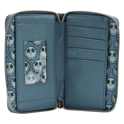 An open zip-around wallet with a blue interior and a repeating skull pattern on the exterior and inner card slots. The wallet features multiple card compartments, a vertical ID window, and a zipper closure.