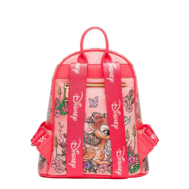 A pink Disney-themed mini backpack featuring Bambi illustrations and floral patterns, with bright pink straps printed with the Disney logo.