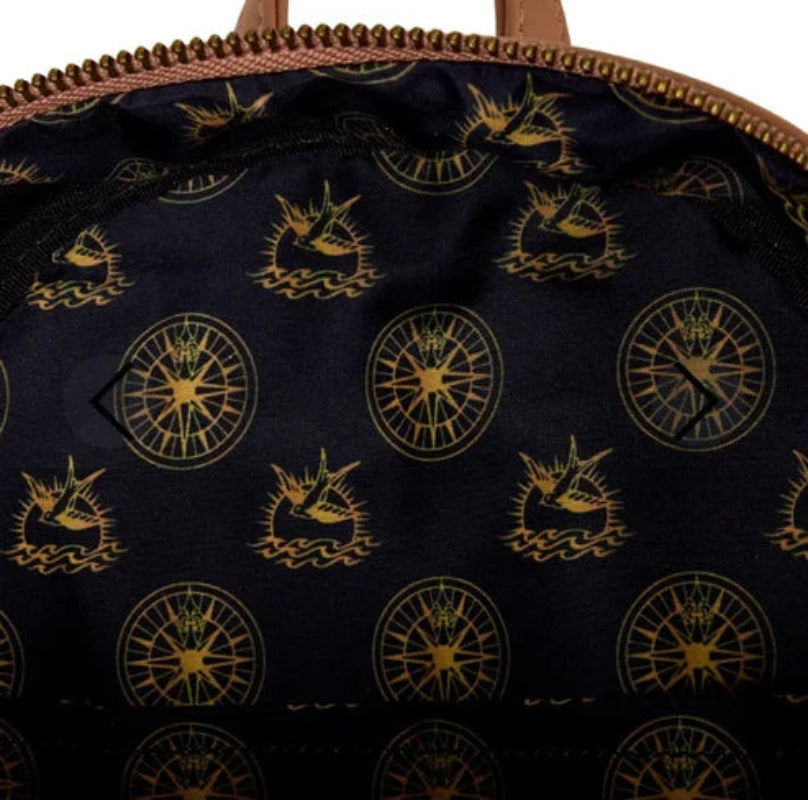 Close-up of a bag with gold patterns on a dark background