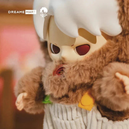 Plush toy with a character wearing a white hat and brown outfit, held by a person.