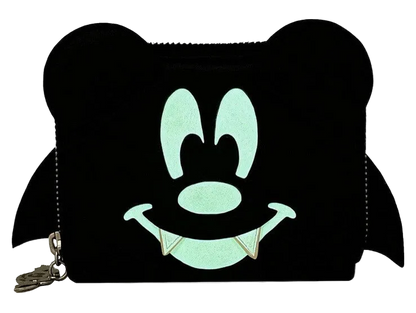 A black coin purse designed like a cartoon character's face with large round ears, a smiling mouth with fangs, and a small gold-tone zipper pull on a white background.