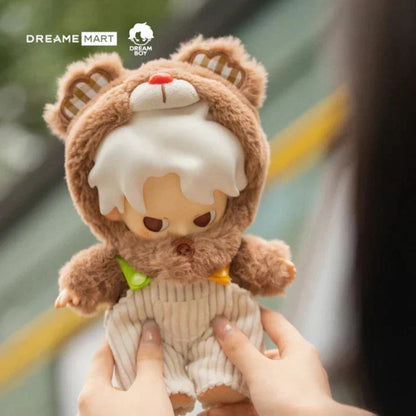 Plush toy with bear ears held by a person, brand 'Dreame Mart' visible