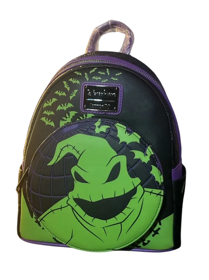 Backpack with green face design on a white background