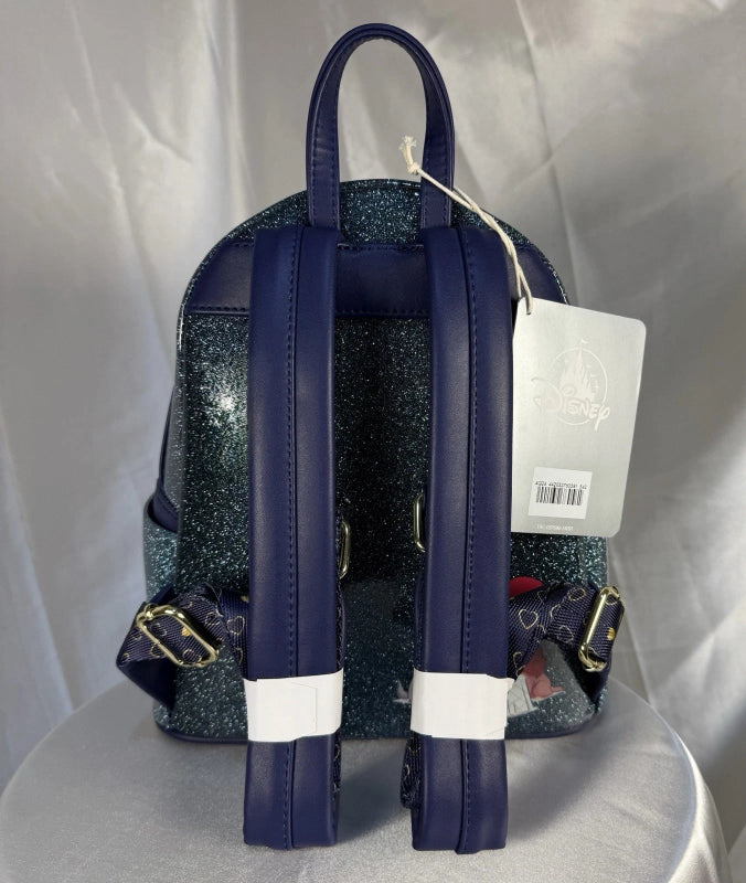 Navy blue backpack with glittery pattern on a white background