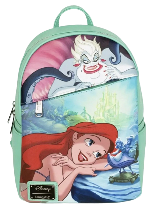 A Disney Toonyou backpack featuring a colorful graphic print of Disney's The Little Mermaid, with Ariel in the foreground and Ursula above, set against a mint green background.
