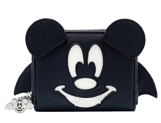A black zip-around coin purse featuring a stylized Mickey Mouse face design in white and black, with mouse ears on top and small bat wings on the sides. A small silver Mickey-shaped charm hangs from the zipper on the left.