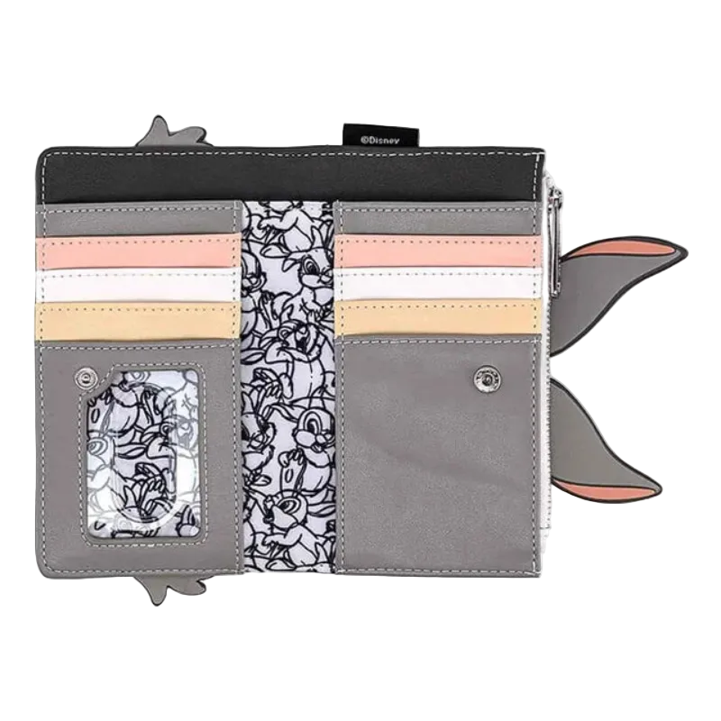 A Loungefly character wallet featuring Tom and Jerry designs, shown open on a white background. The wallet has gray faux leather sections, a black top band, pastel pink and peach card slots, a black-and-white floral patterned center panel, and cartoon character ears extending from the sides.