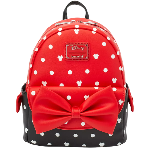 A red and black polka dot mini backpack with a large red bow on the front, featuring a Disney Loungefly logo patch on the upper front.