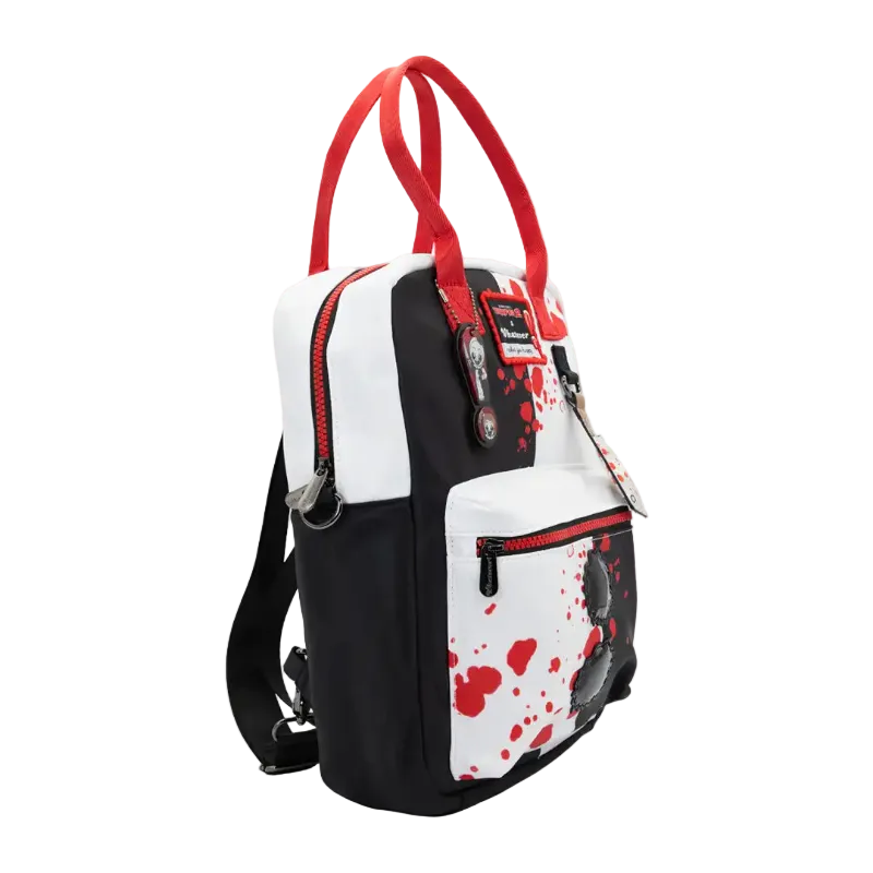 A black and white backpack with red accents, featuring a blood-splatter pattern on the front pocket and red top handles, shown against a plain white background.