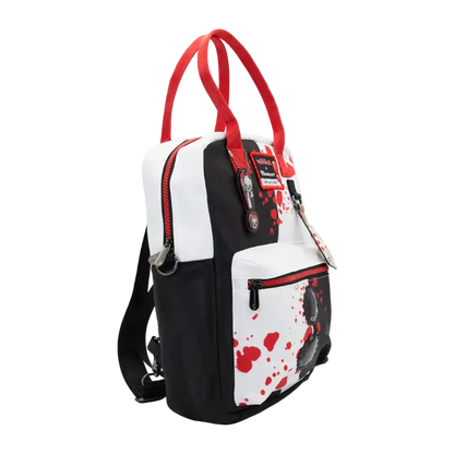 A black and white backpack with red accents, featuring a blood-splatter pattern on the front pocket and red top handles, shown against a plain white background.